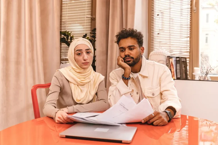 Couple looking through papers at a table