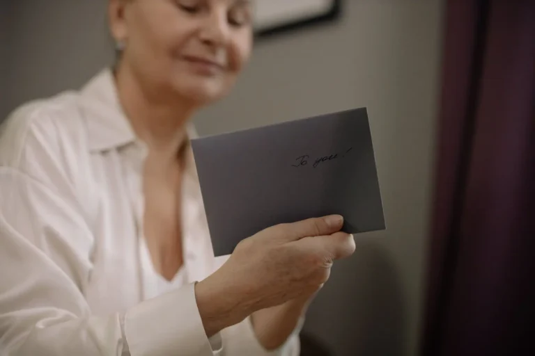 Older woman reading a card