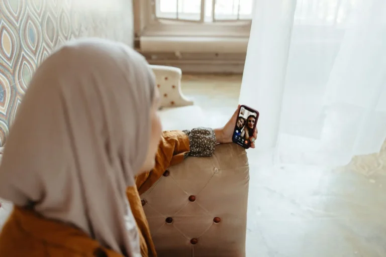 A woman on a video call on her phone at home