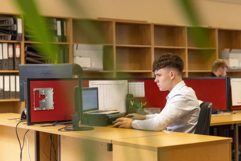 Employee working at a desk in an office