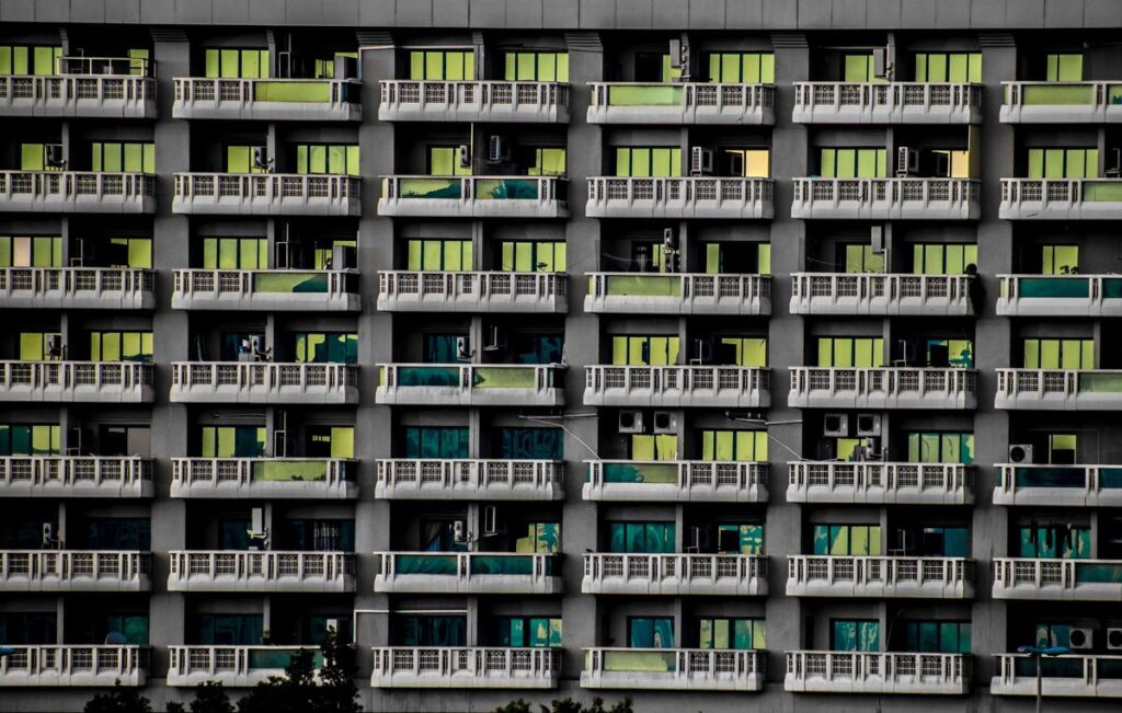 Apartment block facade with rows of balconies in Dubai where residents need proof of address