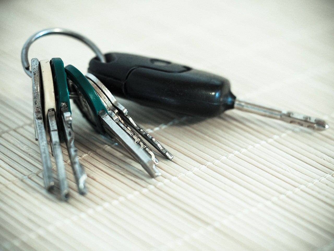 Car key and a bunch of keys on a mat